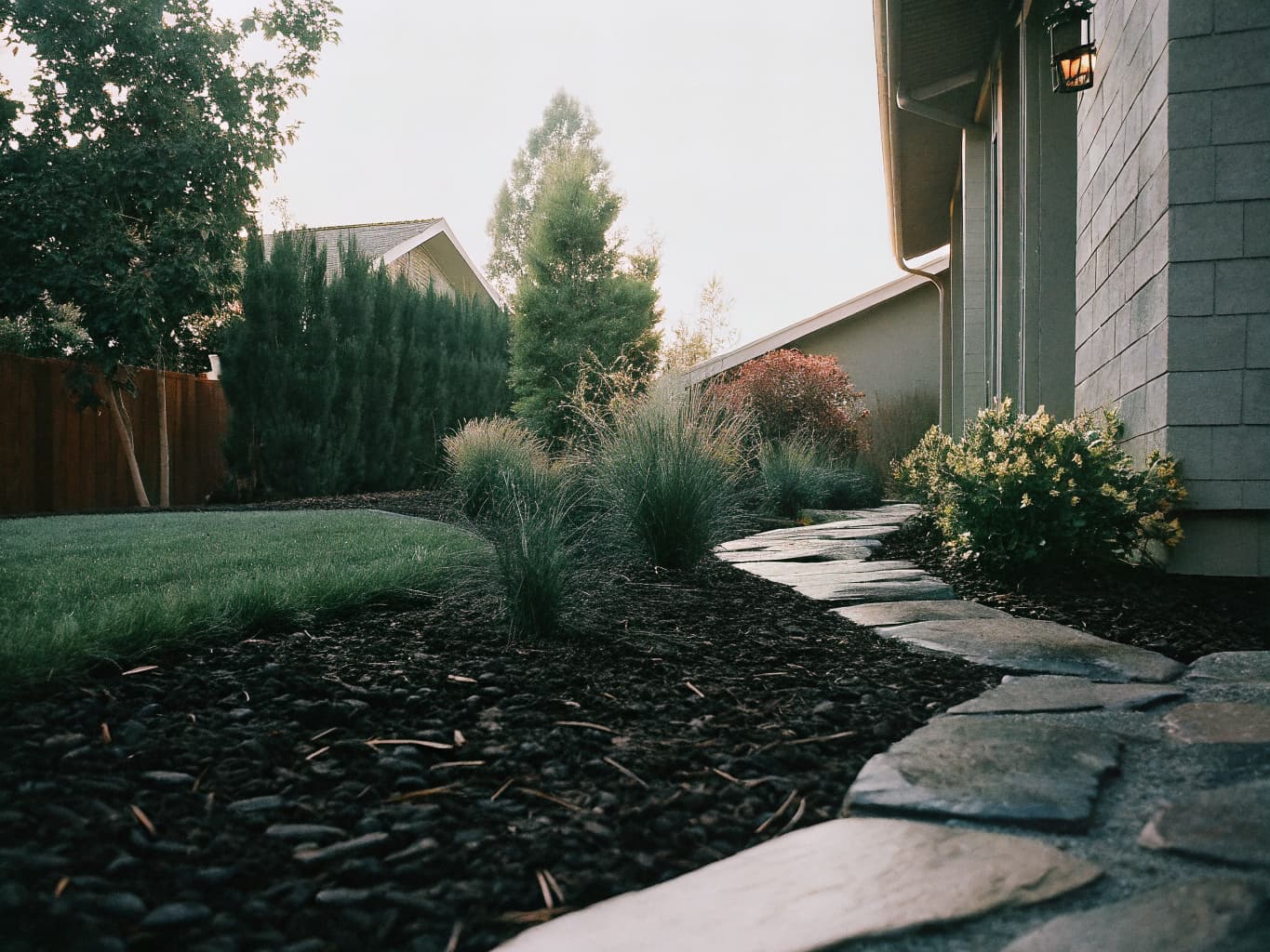Professional landscaping with stone pathway and native California plants